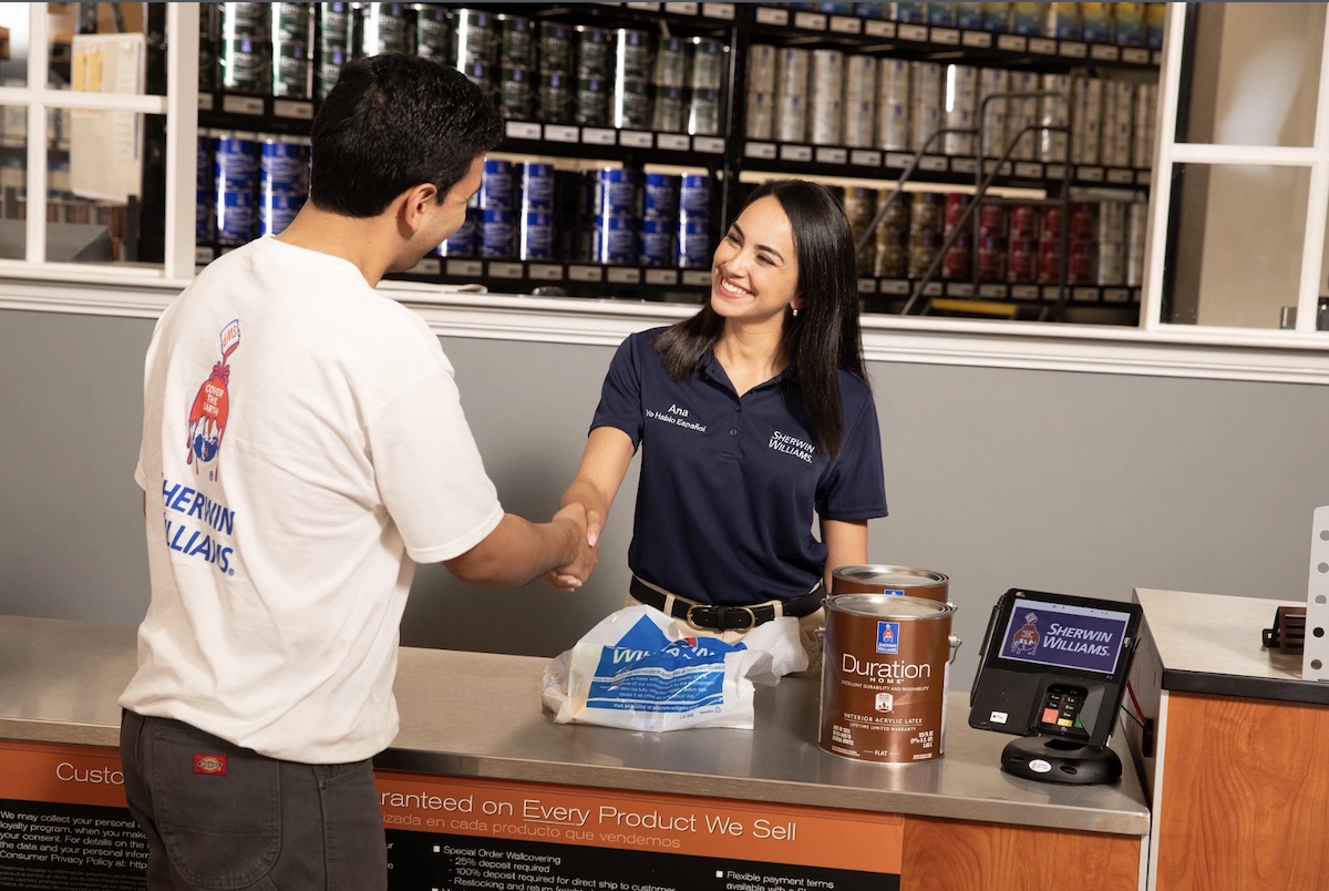 Sherwin-Williams employee with painting contractor at store