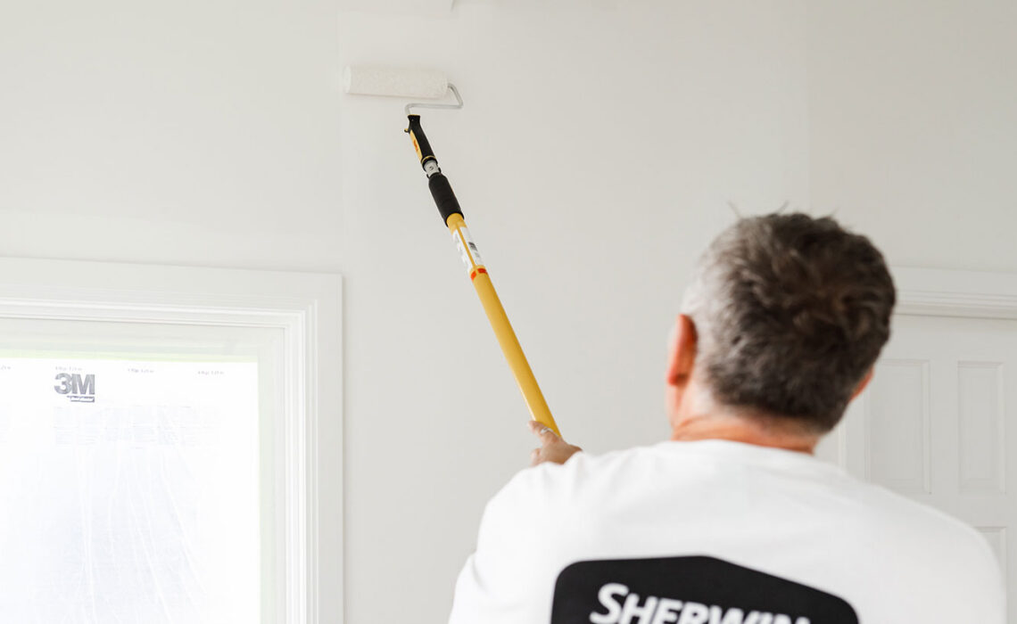 Painter using roller